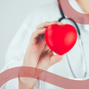 Cuore stilizzato in mano a medico